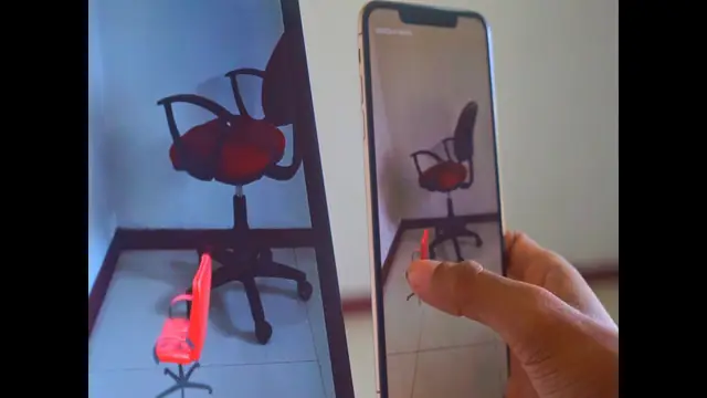 Two phones held side by side, each showing the same virtual red chair in the same spot in a real room
