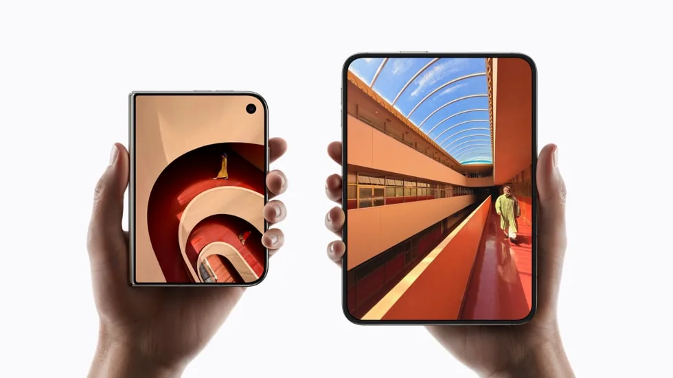 Apple press photo: one hand holds iPhone Duo closed, showing its 5.4-inch outer screen, the other holds it open, showing the 7.6-inch inner screen