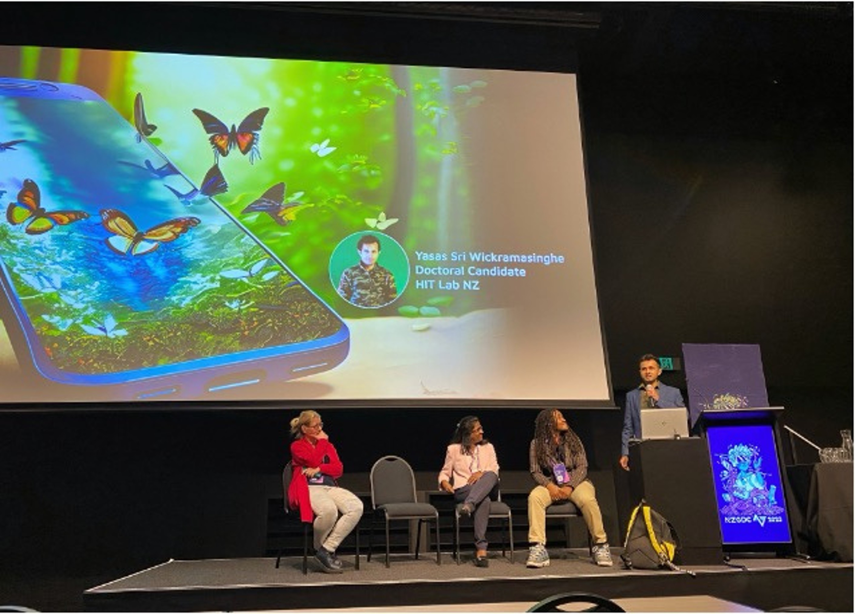 Yasas Sri Wickramasinghe presenting on the AR game development panel at NZGDC 2023, alongside fellow panelists