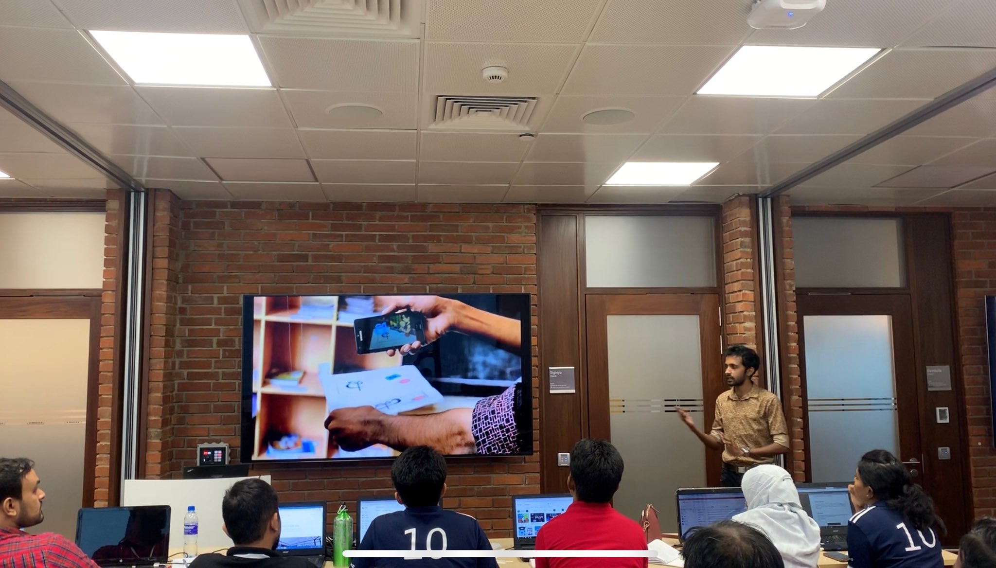 Yasas Sri Wickramasinghe demonstrating an augmented reality prototype to an audience