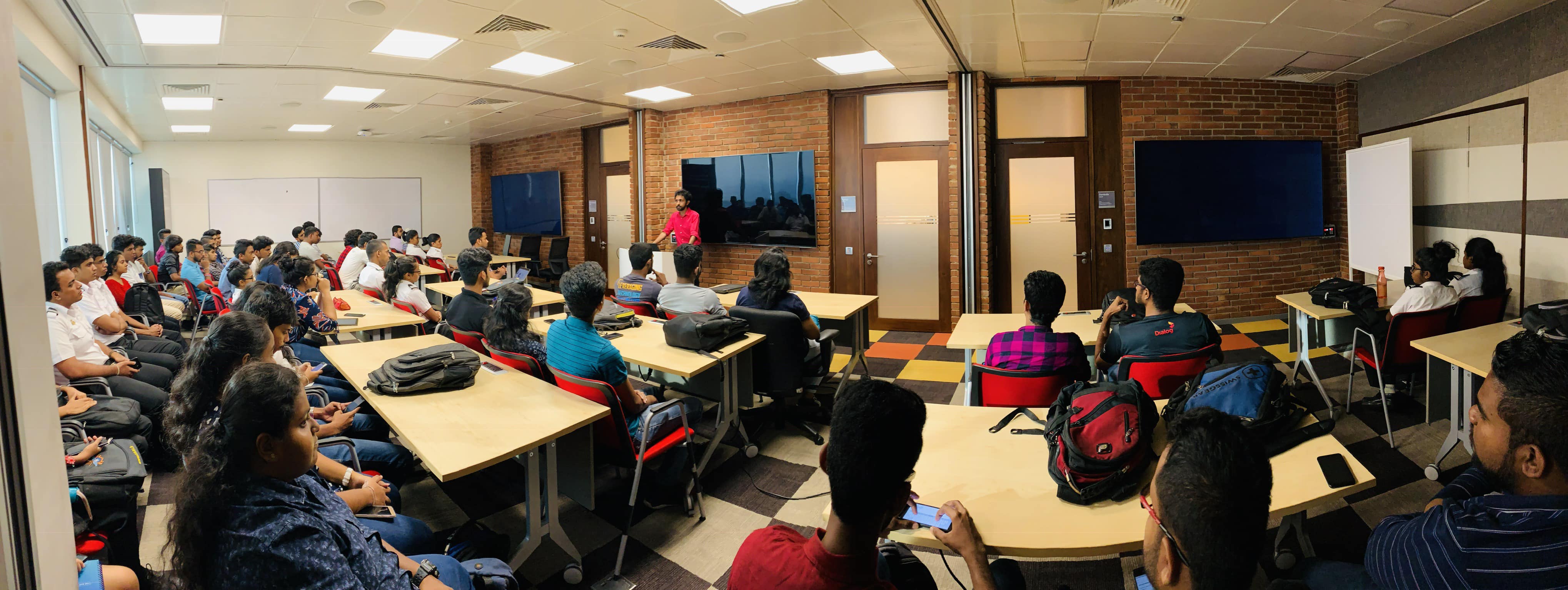 Yasas Sri Wickramasinghe delivering a technical workshop on immersive technology to a packed room of students