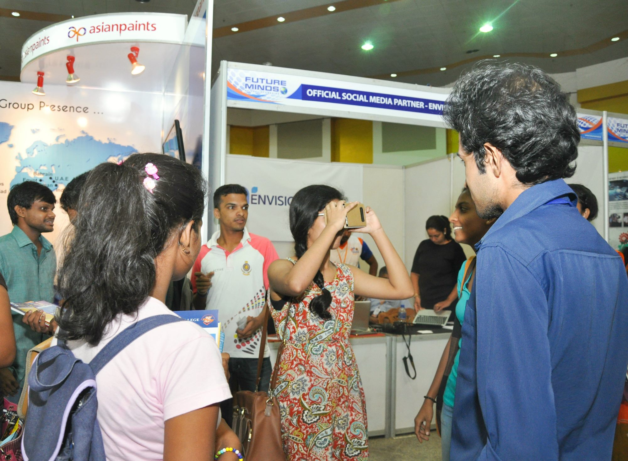 Visitors trying virtual reality at an exhibition booth built by Yasas Sri Wickramasinghe